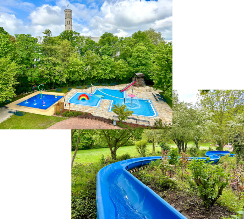Kinderplanschbecken im Freibad Bürgerpark mit buntem Regenbogen-Wasserspiel und Flamingo-Figur Belebtes Schwimmbecken im Freibad Bürgerpark mit Badegästen, Sprungturm und parkähnlicher Umgebung